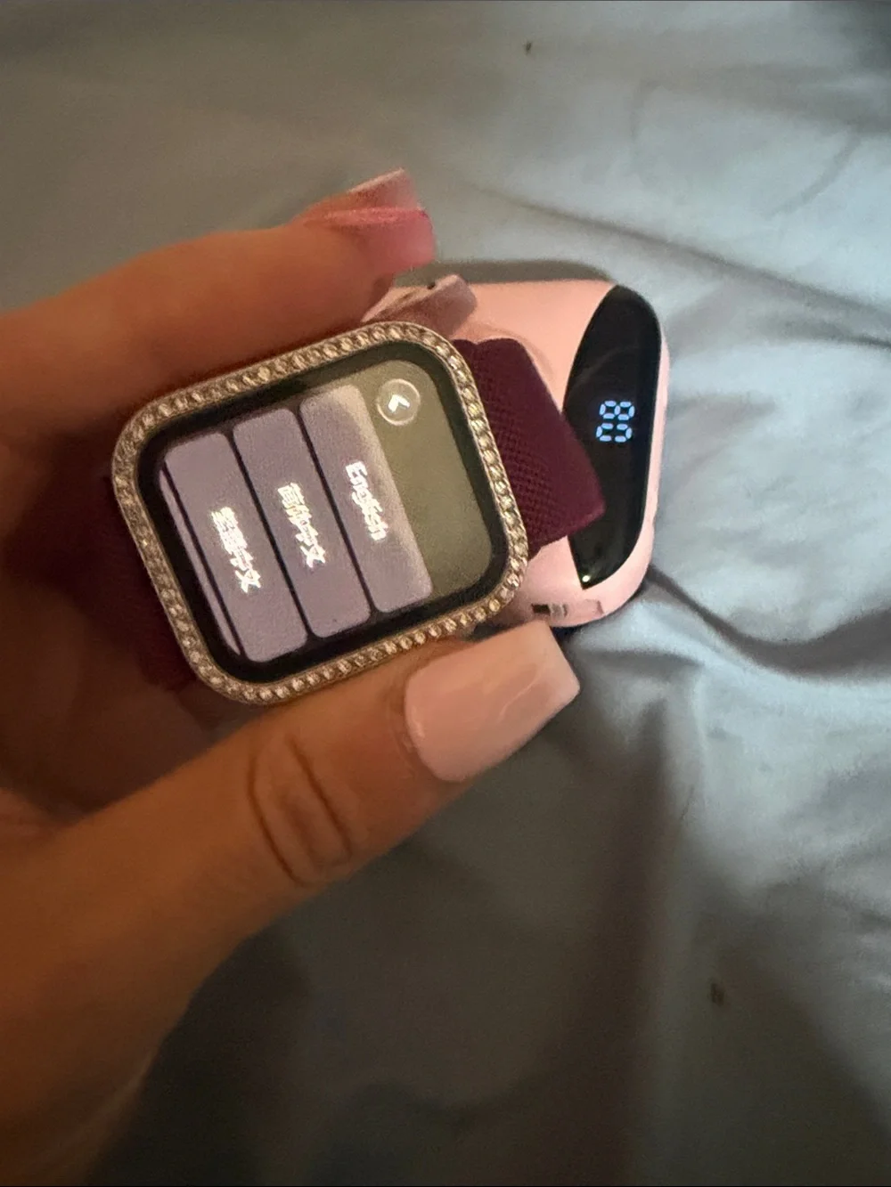 Apple Watch with Burgundy Woven Band, Pink Protective Case and Rhinestone Bezel